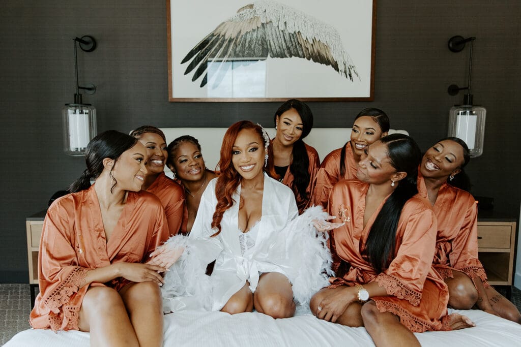 Bride and bridesmaids in getting-ready robes at Elliot Park Hotel in Minneapolis