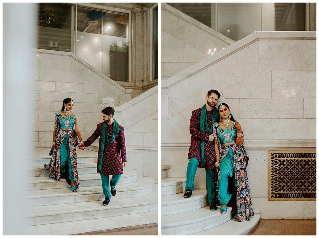 Aarushi and Shane walking hand in hand through the Lumber Exchange in downtown Minneapolis during their Indian wedding