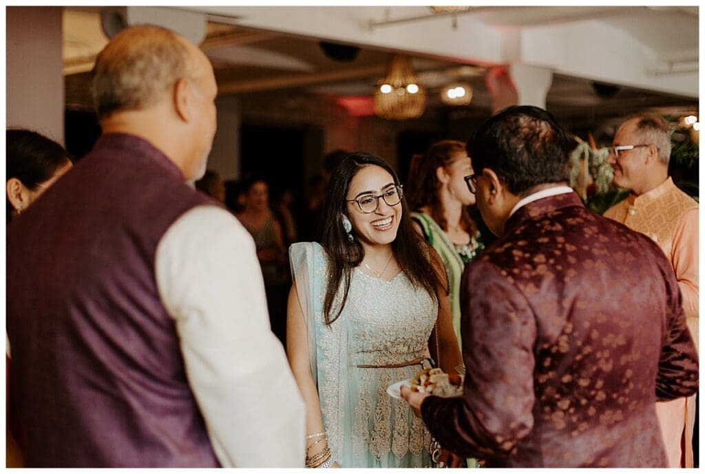 Guests mingling and celebrating during the sangeet at the Lumber Exchange Minneapolis Indian wedding weekend