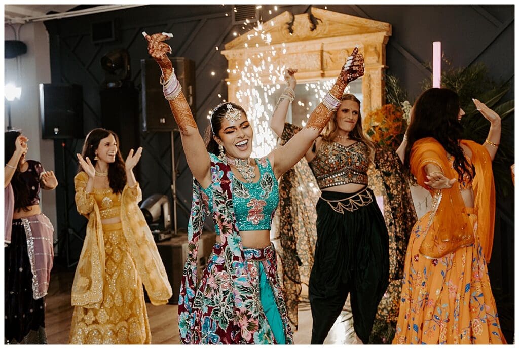 Aarushi making a grand entrance at the sangeet celebration at the Lumber Exchange in Minneapolis