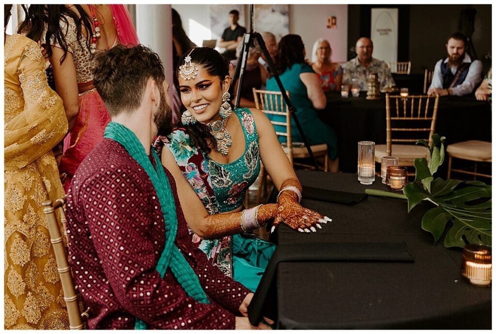 Aarushi and shane chatting during their Minneapolis Indian wedding