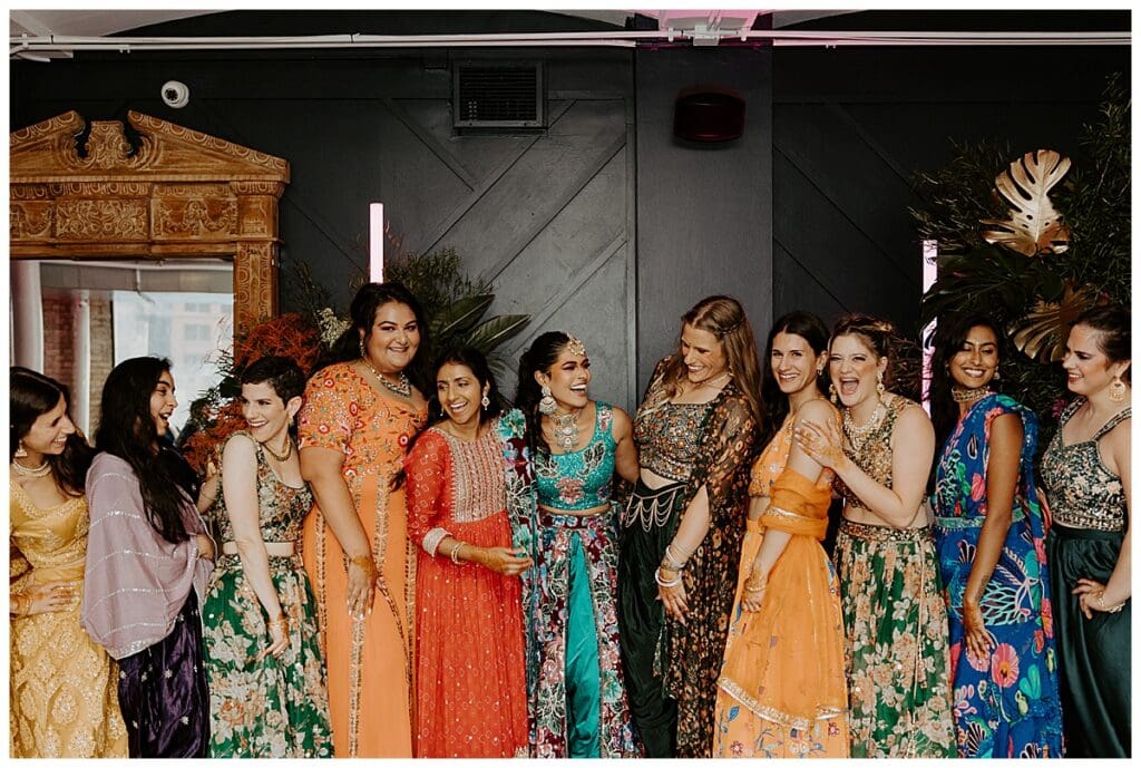Aarushi and guests laughing during the sangeet at the Lumber Exchange Minneapolis