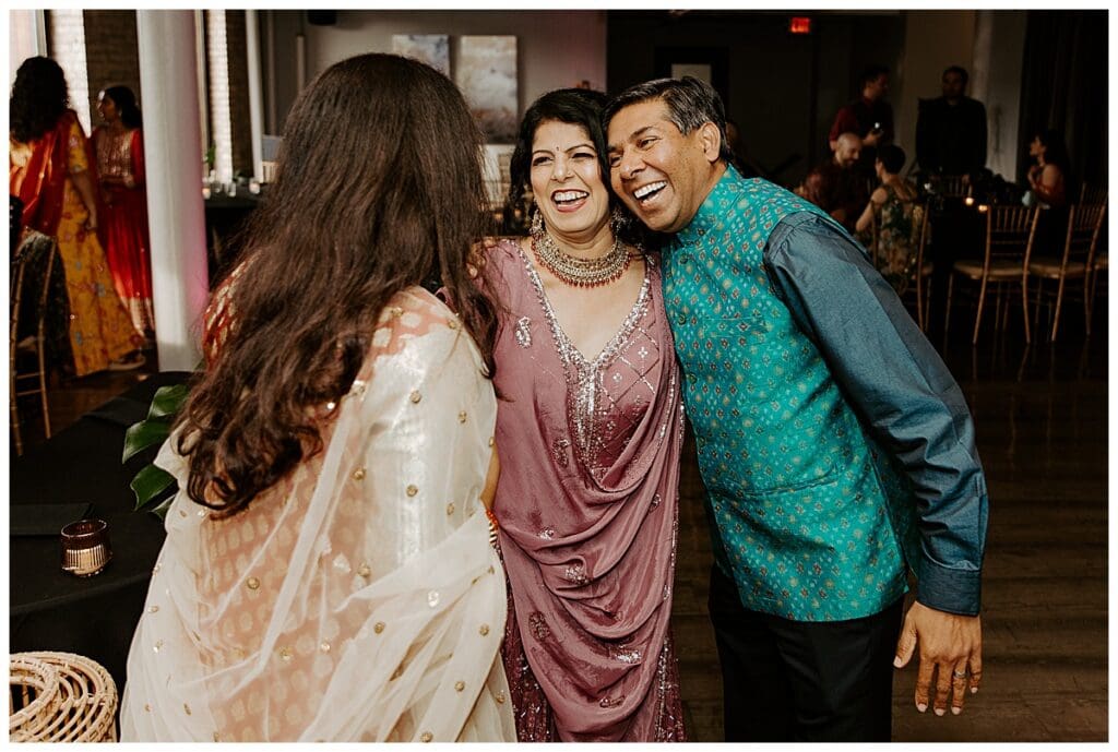 Family members celebrating together at Aarushi and Shane's sangeet in Minneapolis