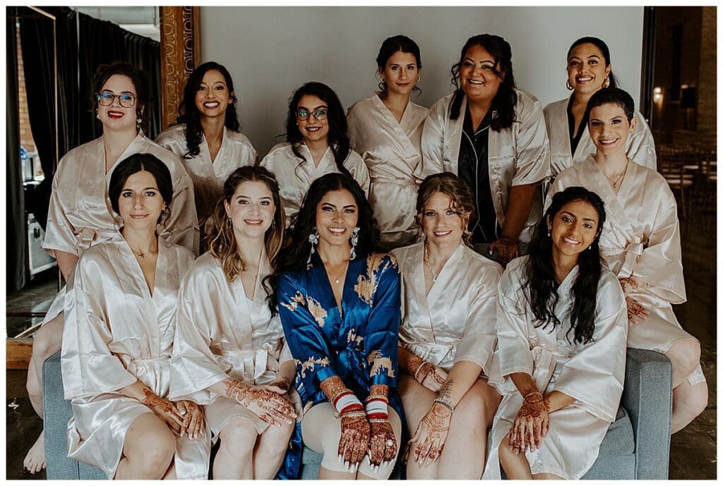 Aarushi and her bridesmaids in matching robes getting ready before the Christian wedding ceremony in Minneapolis