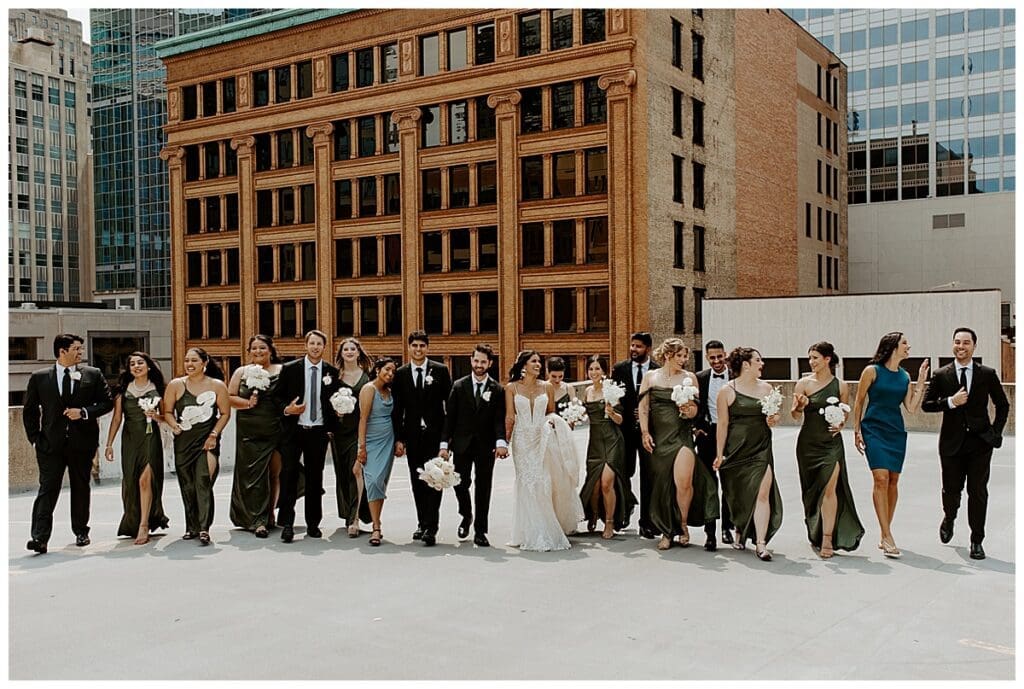 Full wedding party group photo on the rooftop of the Lumber Exchange in downtown Minneapolis