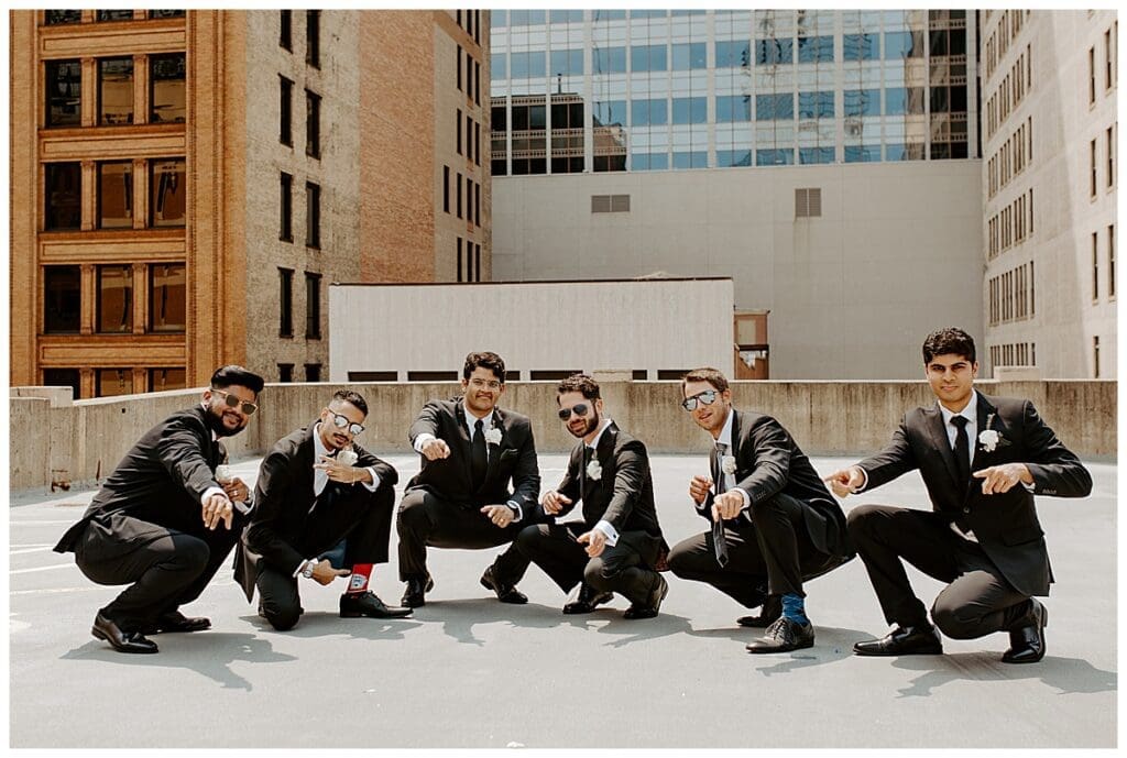 Shane and his groomsmen posing on the rooftop of the Lumber Exchange in downtown Minneapolis