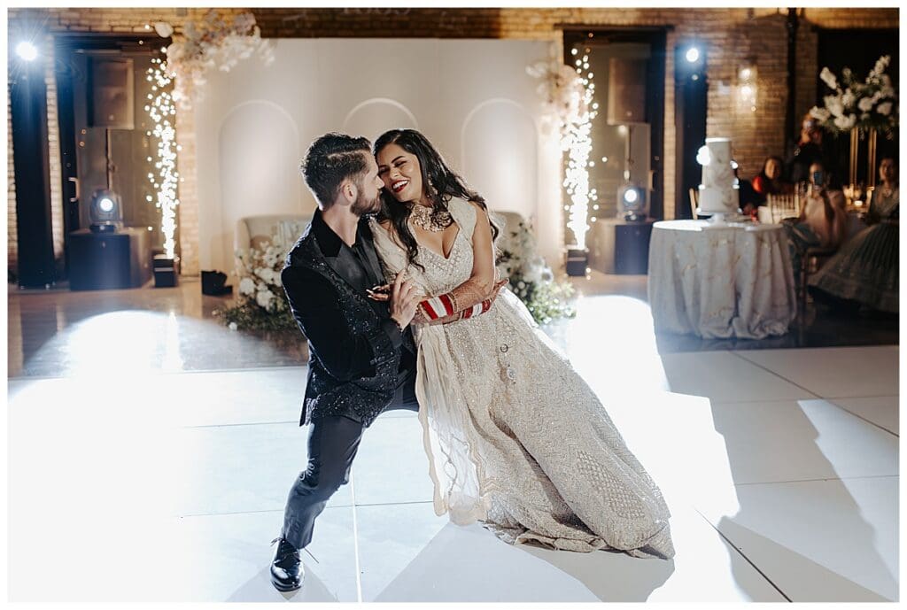 Aarushi and Shane dip during their first dance at the Lumber Exchange reception in Minneapolis
