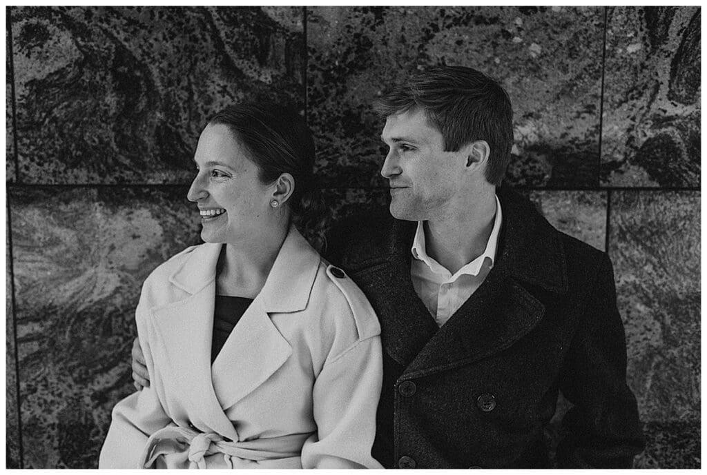 Black and white photo of Meredith and Alec laughing together during their Minneapolis engagement session