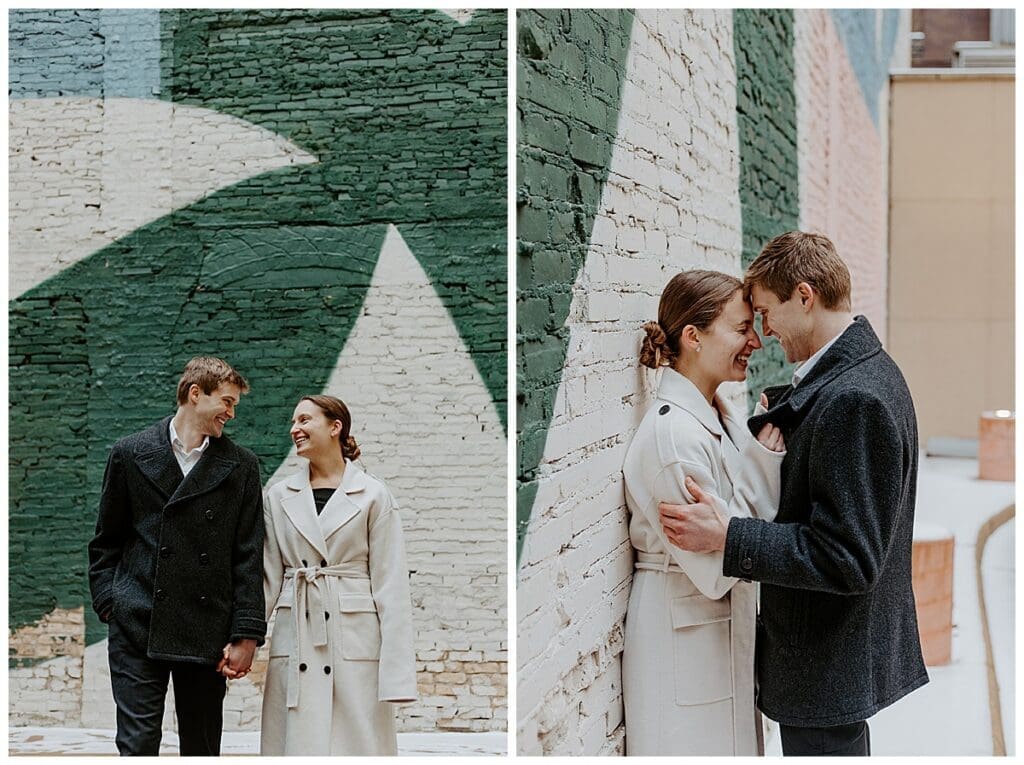 Meredith and Alec in front of a green mural during their downtown Minneapolis winter engagement session